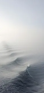 Serene ocean waves creating a calming scene in soft light blue hues.