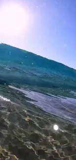 Scenic ocean wave with clear blue sky.