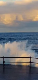 Dramatic ocean wave splashes against coastal barrier at sunset.