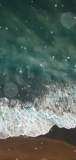 Aerial view of serene teal ocean waves on a sandy shore with gentle foam.