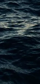 Serene dark blue ocean waves rippling gently.