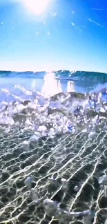 Vibrant ocean wave under a clear blue sky with sunlit reflections.