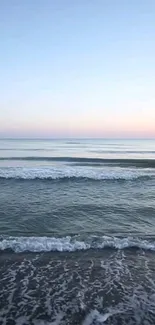 Serene ocean waves under a calm sky, creating a tranquil mobile wallpaper.