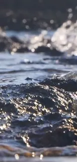 Close-up of serene ocean waves lapping rocky shores, with shimmering water details.