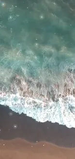 Aerial view of gentle ocean waves at a serene beach, creating a calming scene.