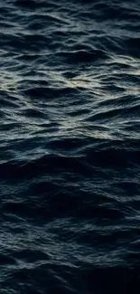 Peaceful ocean waves in navy blue tones.