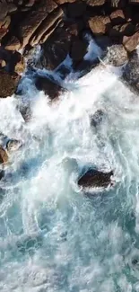 Aerial view of ocean waves crashing onto rocky shore.