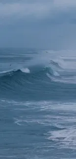 Serene ocean waves with mist in blue tones.