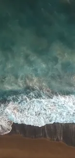 A soothing aerial view of ocean waves hitting the beach.