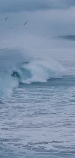 Serene ocean waves with misty horizon and blue water.