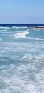 Serene ocean waves crashing on a rocky shore.