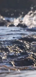 Serene ocean waves crashing over rocks, creating a calming nature scene.