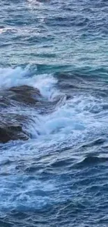 Serene ocean waves crashing against rocks.