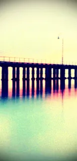 Serene pier at sunset with reflections on calm water.