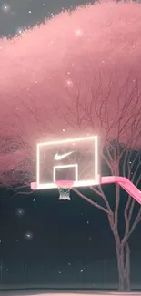 A pink basketball court under a glowing tree at night.