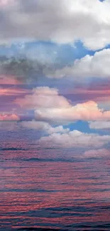 Serene pink sky with clouds over a calm ocean.