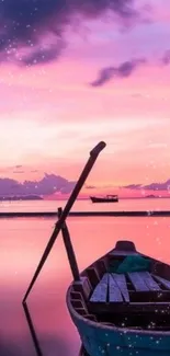 A serene pink sunset with a wooden boat on calm waters.