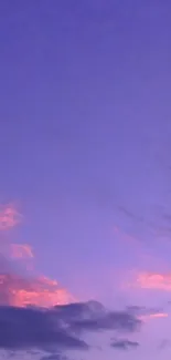 Tranquil purple sky with fluffy clouds.