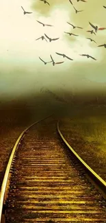 Serene railway track with flying birds in golden light.