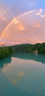 A vibrant rainbow arches over a serene lake under a pastel sky.