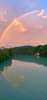 Serene river with rainbow and lush trees.