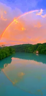 Rainbow reflecting on a serene river at sunset.