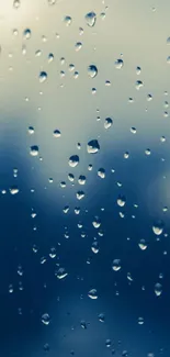 Raindrops on a window with blue gradient background.