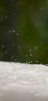 Rain droplets on a surface with a green background, creating a serene atmosphere.