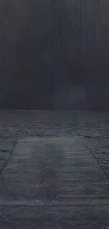 Wooden pier under a rainy night sky.