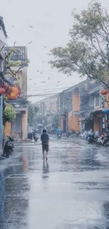 Serene rainy street with lone walker and blue-gray tones.