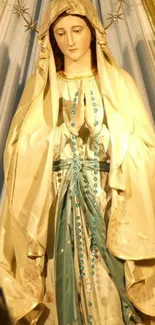 Serene golden statue of a religious figure draped in robes.