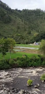 Serene river flowing through a lush green valley landscape.