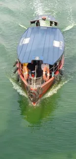 Boat sailing on tranquil green river water.