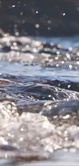 Calming river flow with sparkling water on a mobile wallpaper.