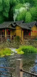 A rustic cottage by a river with lush greenery in the background.