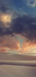 Dramatic clouds over sand dunes at dusk.