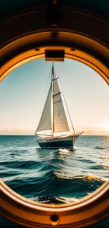 Sailboat framed by porthole with ocean view and sunset glow.