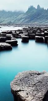 Serene seascape with uniquely shaped rocks in bluish tones.