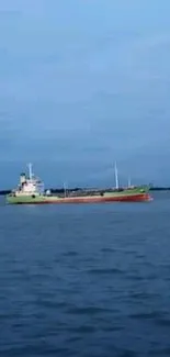 A serene ship sails on calm blue waters under a clear sky.