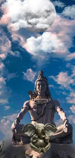 Shiva statue under a serene moonlit sky with clouds.