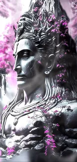 Serene Shiva statue with pink blossoms.