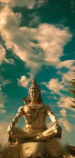 Statue of Shiva under a vibrant blue sky.