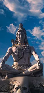 Majestic Shiva statue beneath a vibrant, cloudy sky.