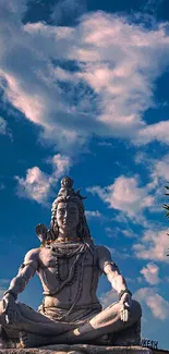 Lord Shiva meditating under the blue sky.