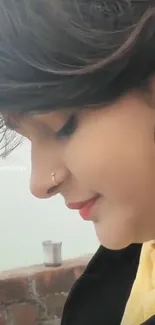 Serene side profile of a woman with colorful earrings.