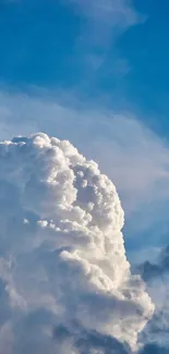 Fluffy white clouds against a bright blue sky, showcasing nature's beauty.