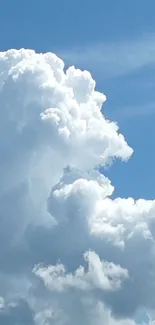 Fluffy white clouds in a blue sky.