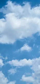 A peaceful sky with fluffy clouds on a blue background.