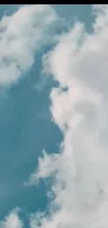 Fluffy white clouds against a blue sky.