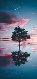 Lone tree reflecting in blue and pink sky at sunset. Serene and calming visual.